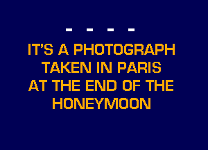 IT'S A PHOTOGRAPH
TAKEN IN PARIS
AT THE END OF THE
HONEYMOON
