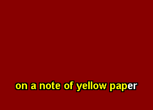 on a note of yellow paper