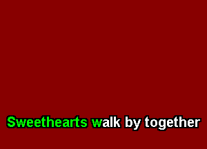 Sweethearts walk by together