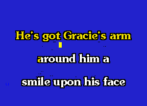 He's got Gracie's arm
n

around him a

smile upon his face