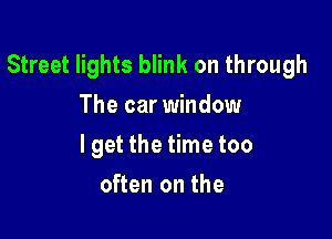 Street lights blink on through

The car window
lget the time too
often on the