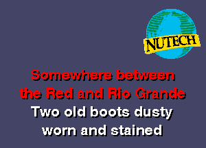 Two old boots dusty
worn and stained